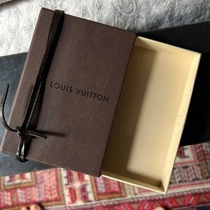 Louis Vuitton box with leather ribbon